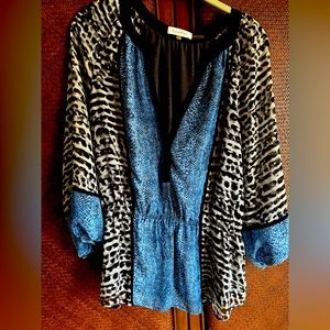 Snake and leopard print blouse.